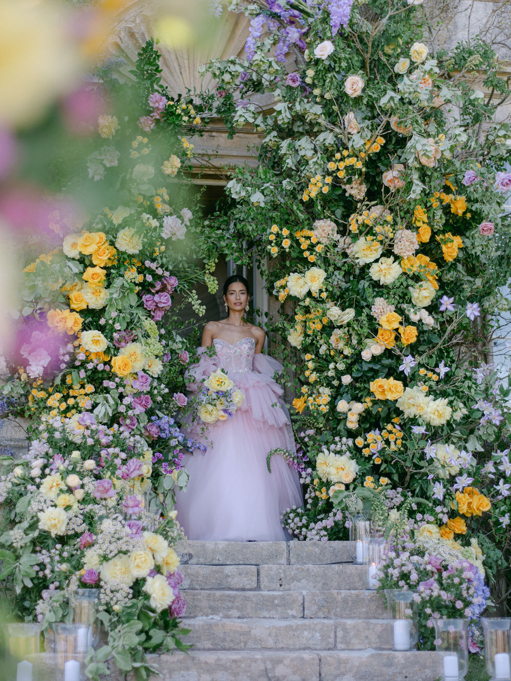 Bride under a flower arch