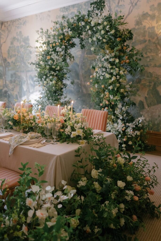 Wedding table with a floral arch 