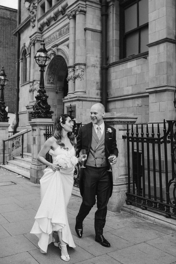 Bride & groom walking at a London wedding